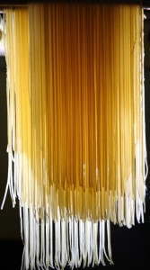 Fresh pasta, hanging to dry before cooking.