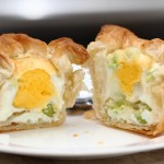 egg with scallion and cheese baked in a puff pastry basket