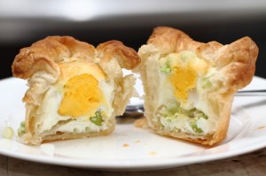 egg with scallion and cheese baked in a puff pastry basket