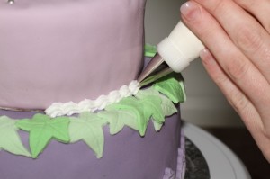 two tiered layered cake, covered and decorated in fondant and royal icing, photos by Laurens de Vries of www.laurens.com