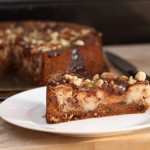 A slice of cheesecake - chocolate chip cookie crust, with chocolate, nuts and caramel filling