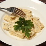 fresh rigatoni with a cheese and parsley sauce