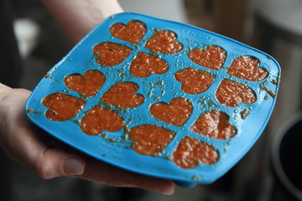 Sauce in ice cube tray to be frozen